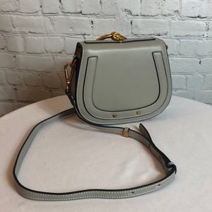 NWOT women’s gray crossbody bag.